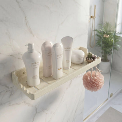 Bathroom shelf with skincare products and a plant in a modern bathroom setting