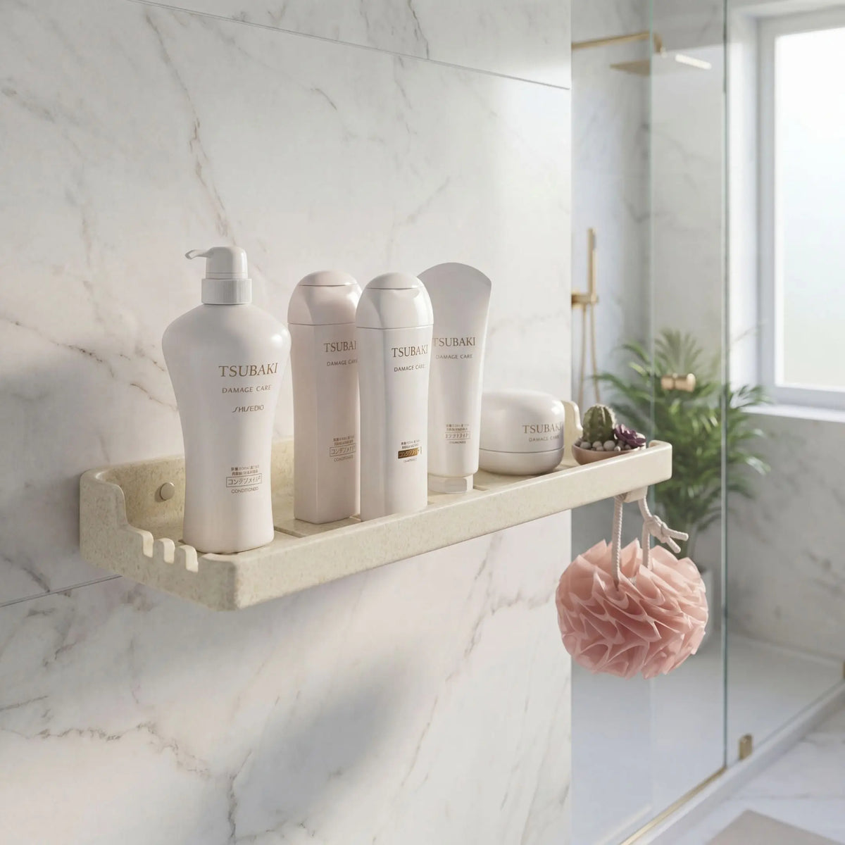 Bathroom shelf with Tsukaido skincare products against a marble wall.