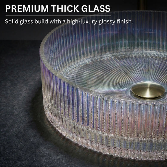 Glass table with ribbed design and gold base on a dark surface, highlighting premium thick glass quality.