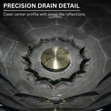 Close-up of a precision drain detail with clear crystal work and metallic center.