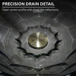 Close-up of a precision drain detail with clear crystal work and metallic center.