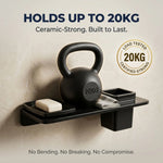 Black kettlebell on a shelf with text about its strength capacity and certification.