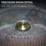 Close-up of a glass object with a gold center and text about precision drain detail.
