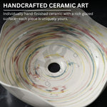 Handcrafted ceramic art piece with multicolored glaze pattern on a black background