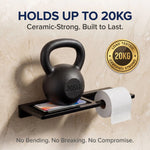 Black kettlebell on a shelf with a toilet paper roll, labeled '20KG' and 'Ceramic-Strong'.