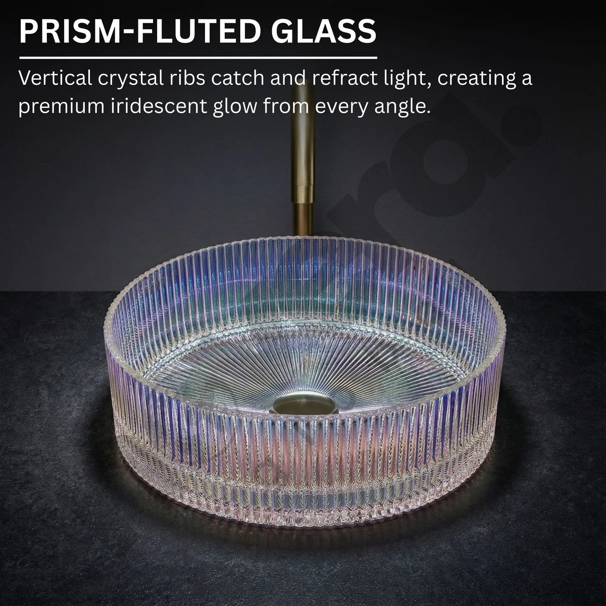 Prism-fluted glass sink with iridescent glow on a dark background