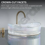 Glass sink with faucet labeled 'Crown-Cut Facets' on a gray background