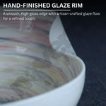 Close-up of a ceramic bowl with a hand-finished glaze rim, showing a smooth, high-gloss edge.