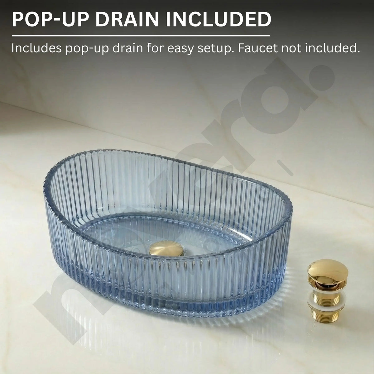 Blue glass sink basin with gold pop-up drain on a light background