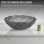 Glass basin with pop-up drain on a gray background