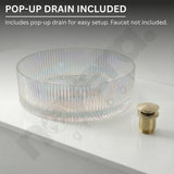 Clear glass sink basin with gold pop-up drain on a white background