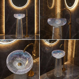 Bathroom sink with gold faucet and illuminated mirror in a dark room.