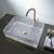 Decorative glass sink with gold faucet on a dark surface