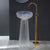 Glass sink with gold faucet against a dark wall