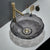 Glass sink with gold faucet on a white countertop