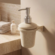Beige soap dispenser mounted on a bathroom wall with a neutral color scheme.