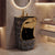 Luxury bathroom with a marble-patterned sink and gold accents.