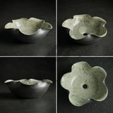 Floral-shaped ceramic bowl on a dark background