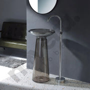 Bathroom sink with faucet against a gray wall