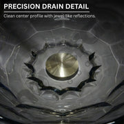 Close-up of a precision drain detail with clear crystal work and metallic center.