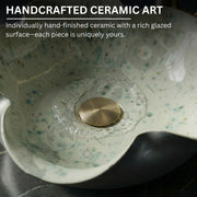 Handcrafted ceramic art piece with a rich glazed surface and gold accent.