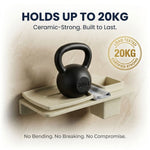 Black kettlebell on a beige shelf with text about weight capacity and material strength.