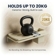 Black kettlebell on a beige shelf with text about weight capacity and material strength.