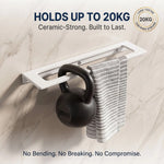 Kettlebell hanging on a white rack with text about weight capacity and durability.
