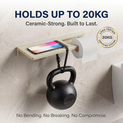Wall-mounted shelf holding a kettlebell and smartphone with text about weight capacity and durability.