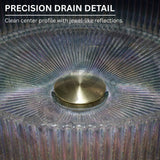 Close-up of a glass object with a gold center and text about precision drain detail.