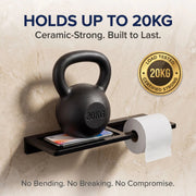 Black kettlebell on a shelf with a toilet paper roll, labeled '20KG' and 'Ceramic-Strong'.