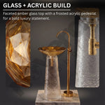 Glass and acrylic bathroom fixture with amber glass top and frosted acrylic pedestal.