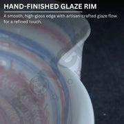 Close-up of a ceramic bowl with a hand-finished glaze rim on a dark background