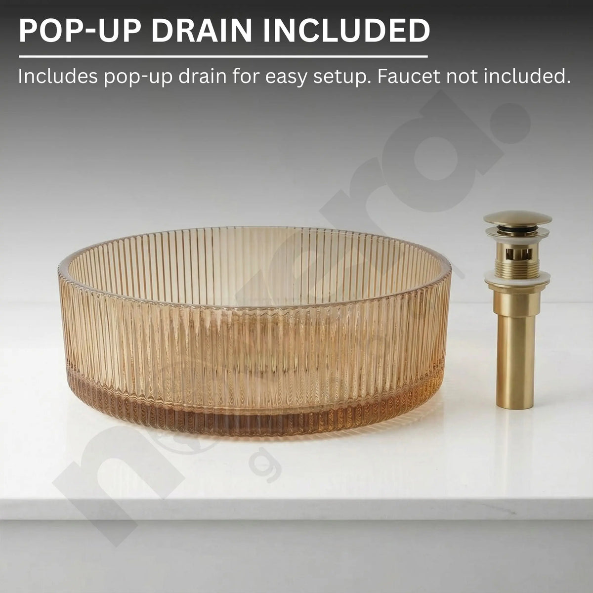 Glass sink basin with gold pop-up drain on a white background