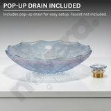 Decorative glass bowl with a pop-up drain on a gray background