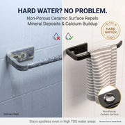 Towel rack with hard water damage on one side and clean side on the other, with text about non-porous ceramic surface.