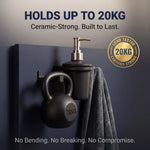 Black kettlebell and soap dispenser on a dark surface with text about weight capacity and certification.