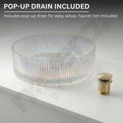 Clear glass sink basin with gold pop-up drain on a white background