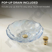 Clear glass sink basin with gold faucet on a white background, featuring text about a pop-up drain.