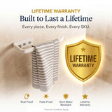 Towel rack with striped towel and lifetime warranty badge on a light background