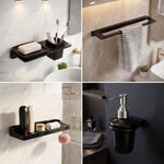 Bathroom accessories including a soap dish, towel rack, and soap dispenser on a marble wall.